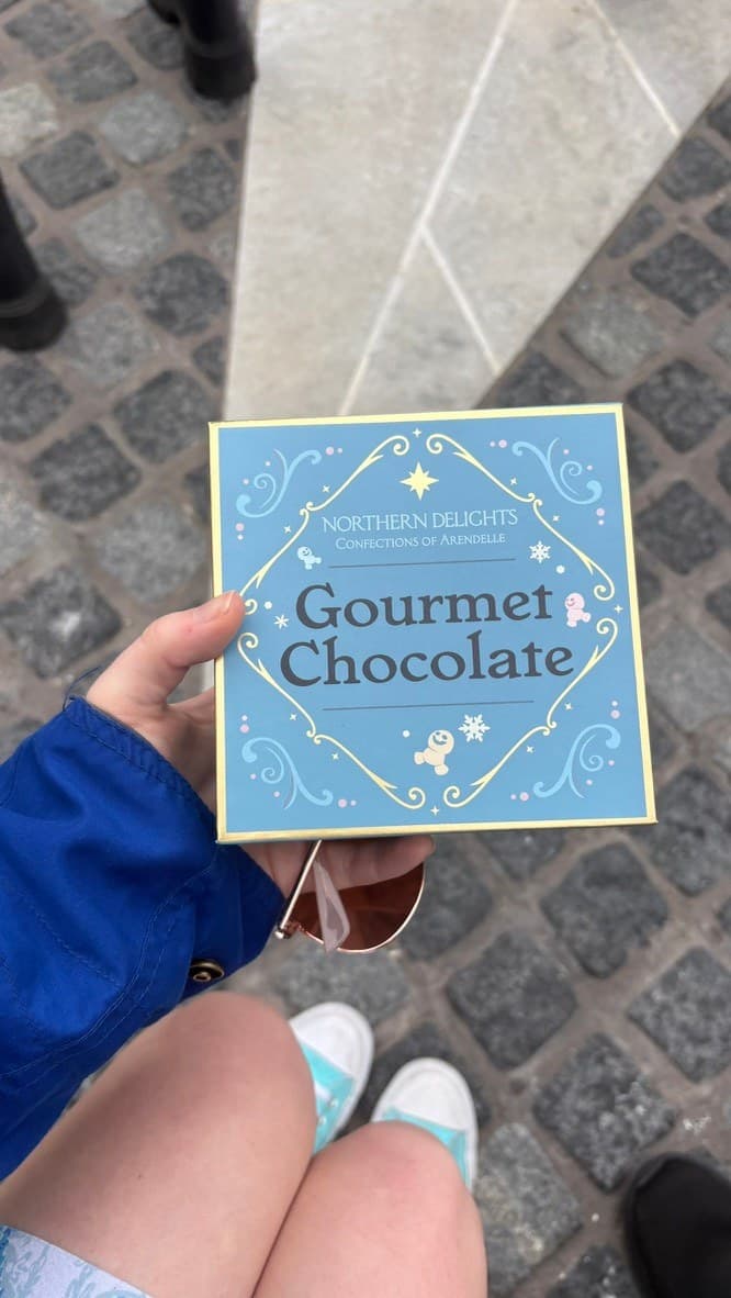 A blue Northern Delights chocolate box with Olaf and snowflake illustrations.