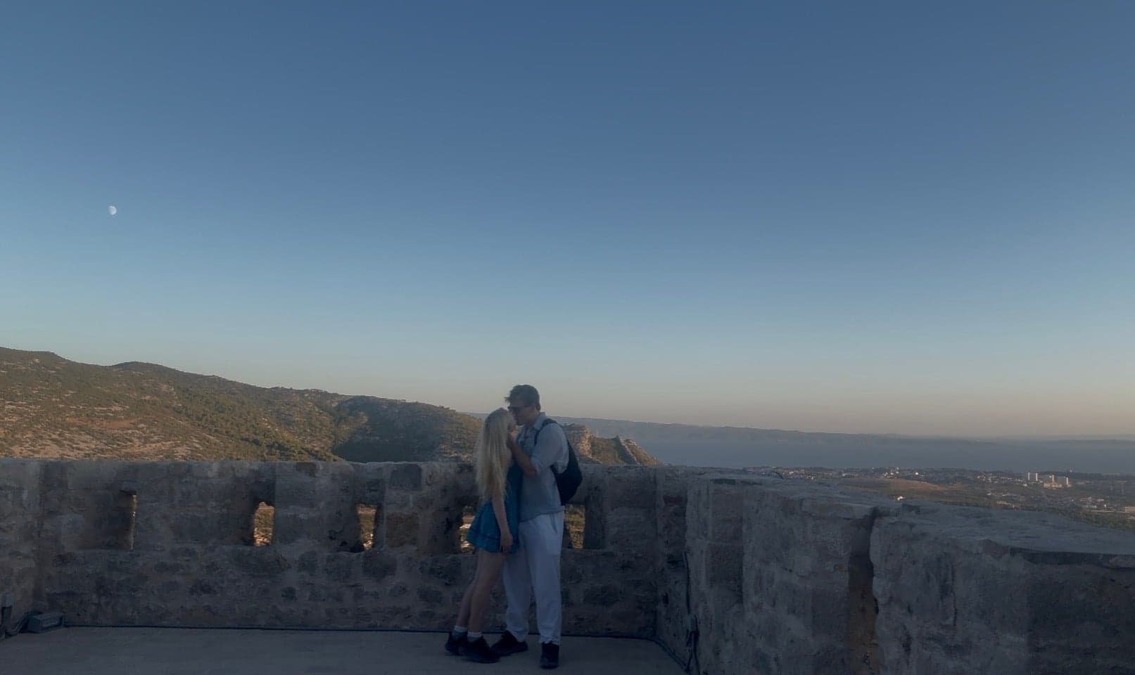 Hannah sharing a kiss at Klis Fortress in the evening light