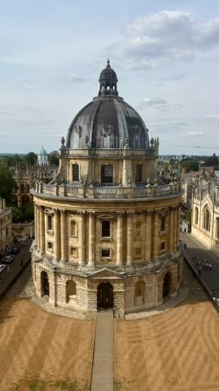 The domed Radcliffe Camera and surrounding Oxford buildings seen from above.